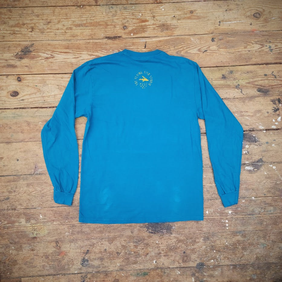 A long sleeve t-shirt in blue with the Flying Fish logo on the back neck.