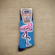 A pair of blue socks with pink flamingos on them.