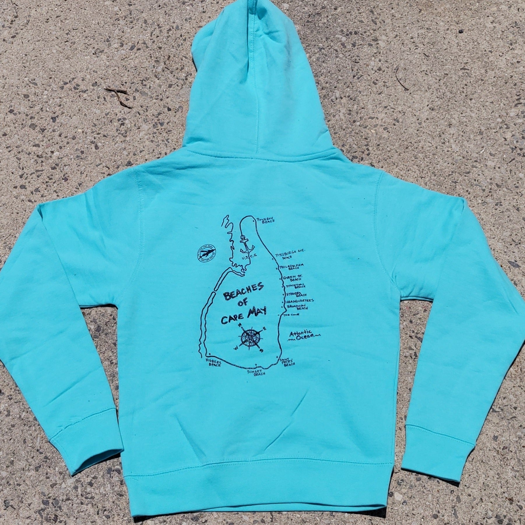 Aqua Blue, pull-over hoodie featuring the 'Beaches of Cape May' design on the center back in navy ink.
