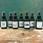 An assortment of body spray bottles.