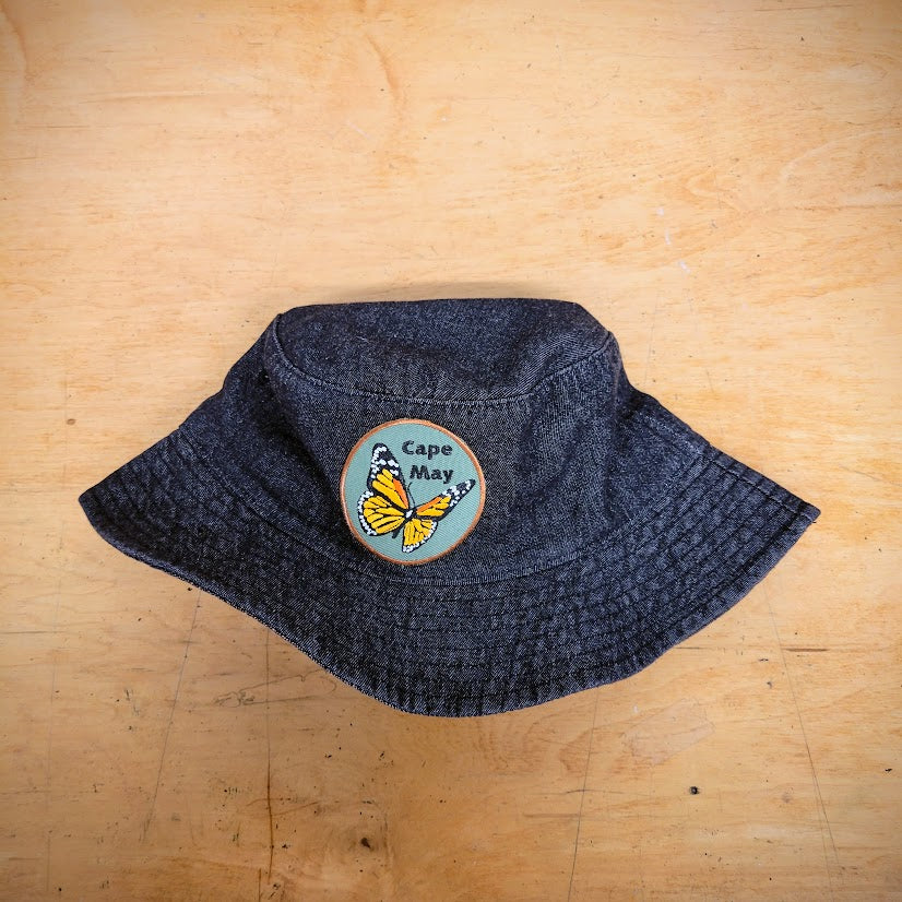 A black hat with a 'Monarch' patch on it.