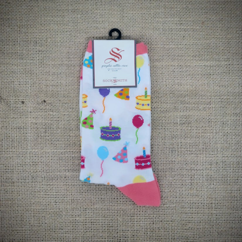 A pair of white and pink birthday cake socks.