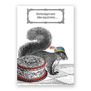 A birthday greeting card featuring a black and white illustration of a squirrel sitting next to a birthday cake with a "Birthdays are like squirrels..." text above. 