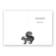 Imagine of an open birthday card that has an illustration of a squirrel wearing a hat and text that reads, "A lot of scurrying activity centered around a nut. Happy Birthday!"