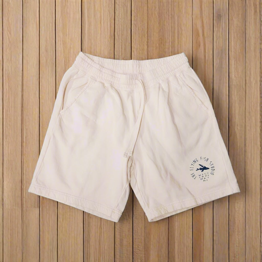 A pair of cotton, ivory shorts.