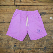 A pair of bright violet, cotton shorts.