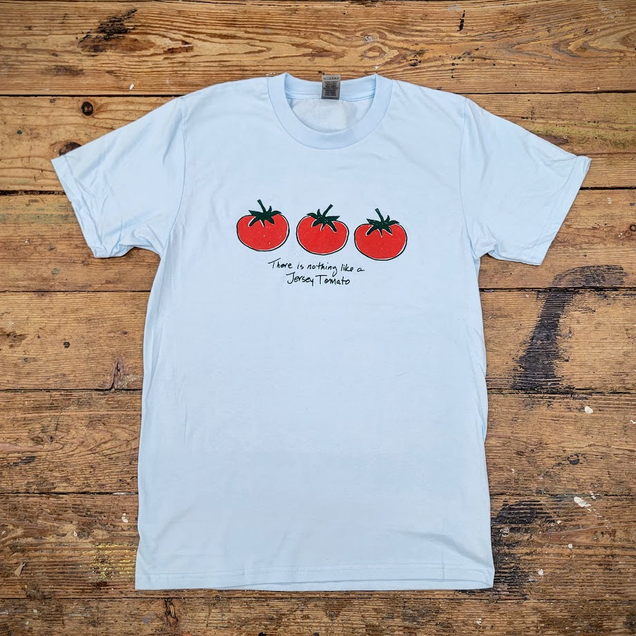 Blue T-shirt with a graphic of three red tomatoes on the front and the words, "There in nothing like a Jersey Tomato" on the front.