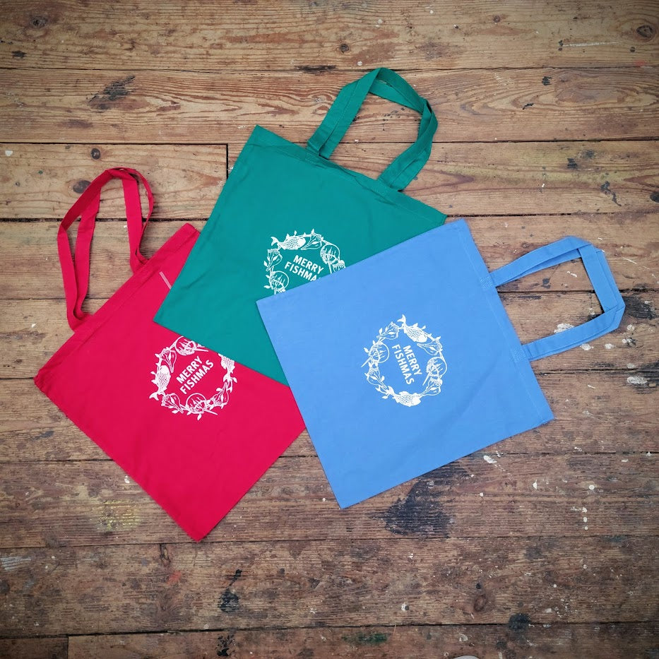 An array of holiday tote bags.