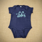 A navy baby onesie with a graphic of sloths riding a tandem with a surfboard.