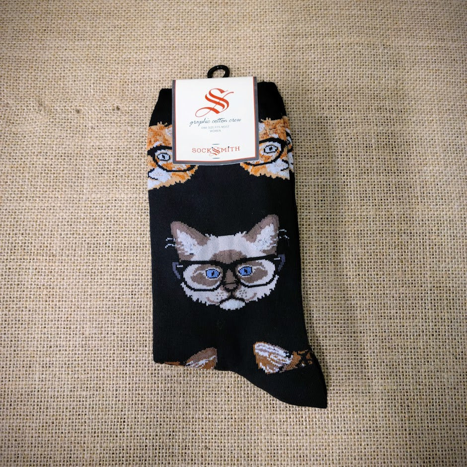 A pair of black socks with cats wearing glasses on them.