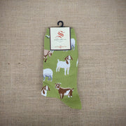 A pair of green socks with goats on them.