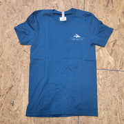 The front of a deep blue T-shirt laid flat on a wooden surface. The shirt has coordinates and a design of a fish on the left chest in white ink.
