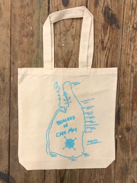 A picture of a tote bag with the 'Beaches of Cape May' design on the front in blue ink.