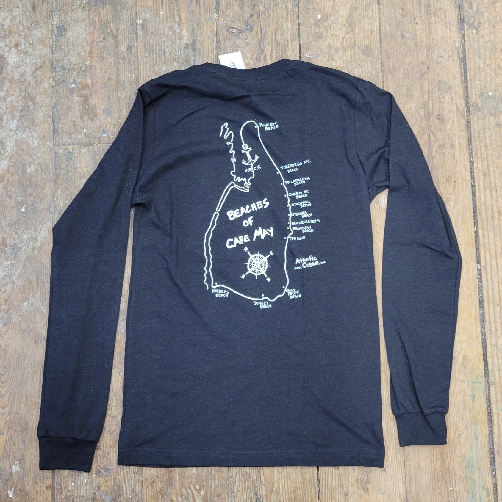 Heather, black long-sleeve with a 'Beaches of Cape May' design on the back in white ink.