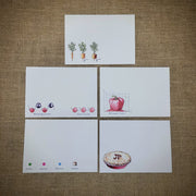 Samples of the set of notecards, depicting mathematical veggies designs.