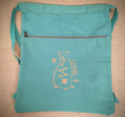 A seafoam blue drawstring bag with the beaches of Cape May on the front in orange ink.