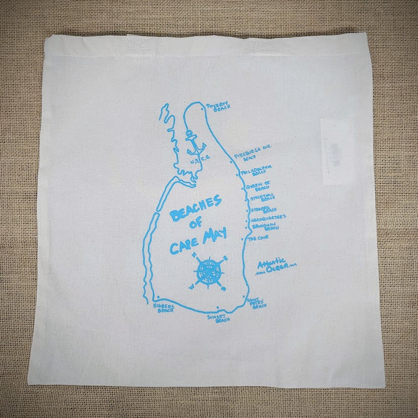 A close-up of a tote bag with the 'Beaches of Cape May' design in blue on the front.