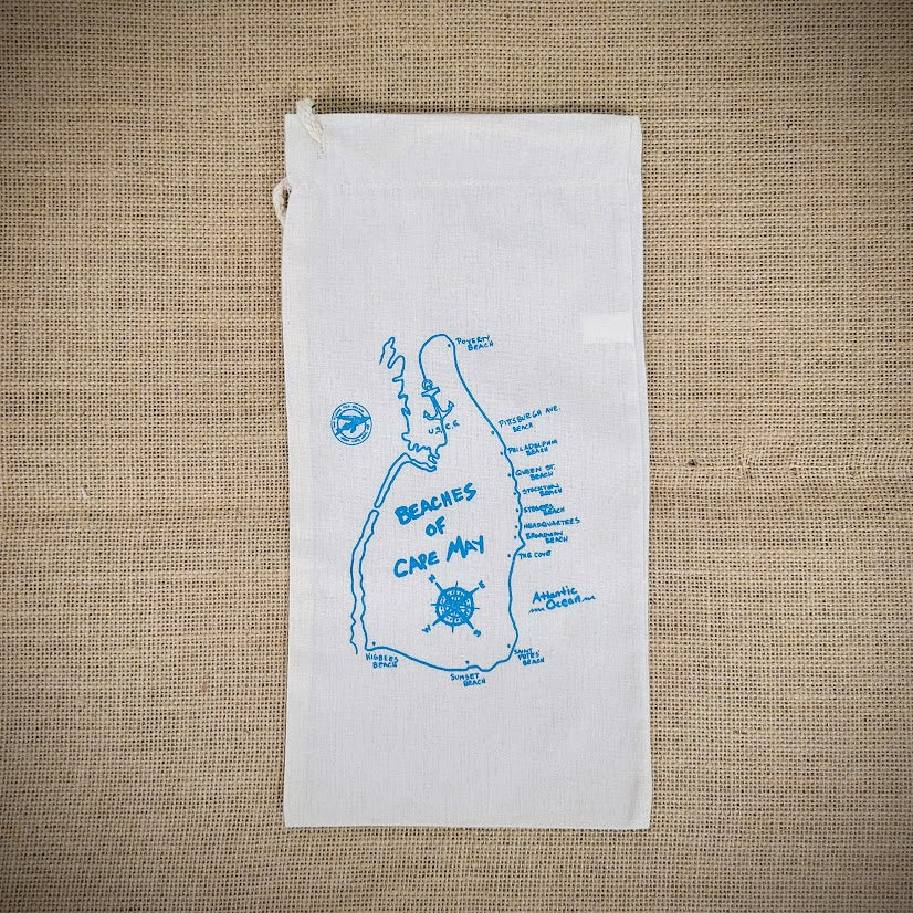 Natural, canvas wine bag that features the beaches of Cape May in light blue ink.