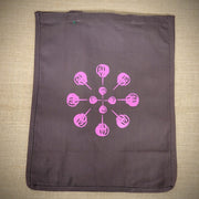 A brown grocery bag with a purple horseshoe crab mandala on it.