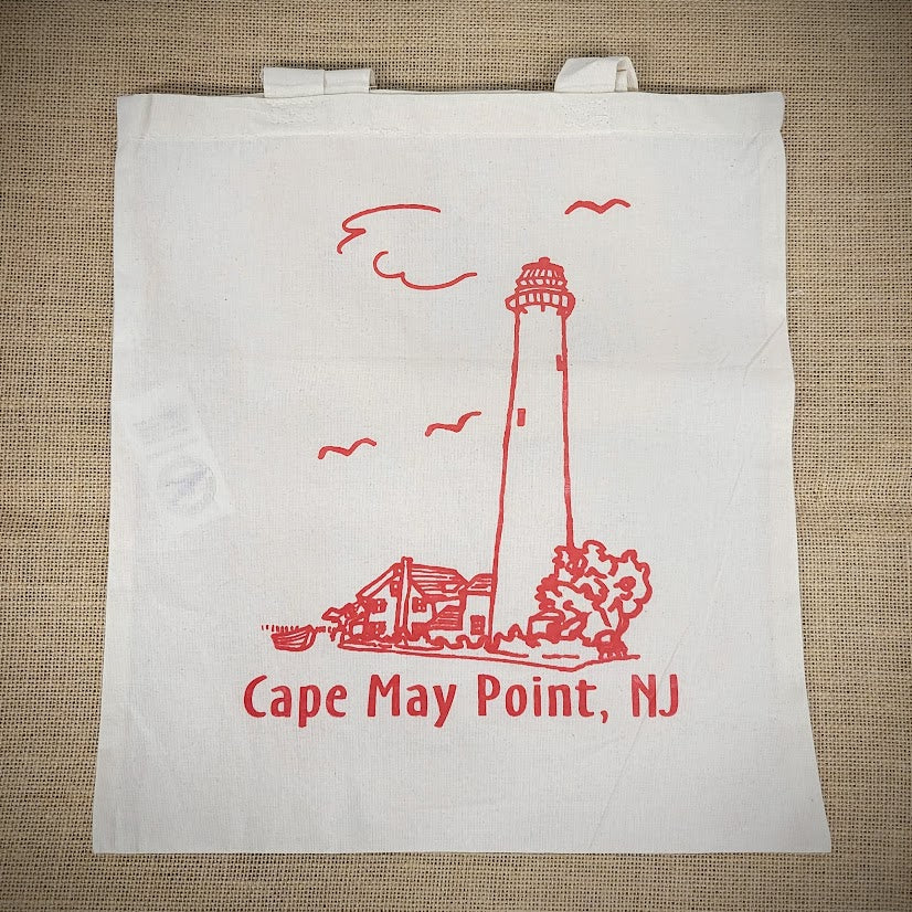 Natural, canvas tote bag with a red design of Cape May Point, NJ on the front.