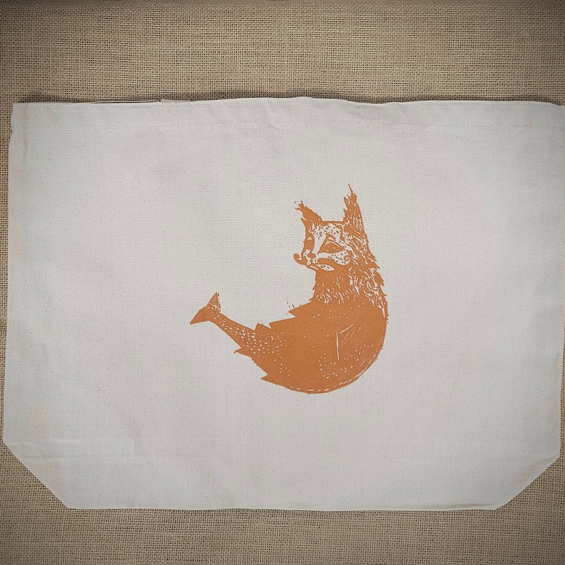 Natural, canvas tote bag with an orange 'cat-fish' screen-printed on the front.