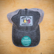 A black, trucker hat with a 'Drink Local' patch on the front.