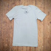 A minty-blue t-shirt with the 'Flying Fish Studio' logo on the back neck in navy ink.