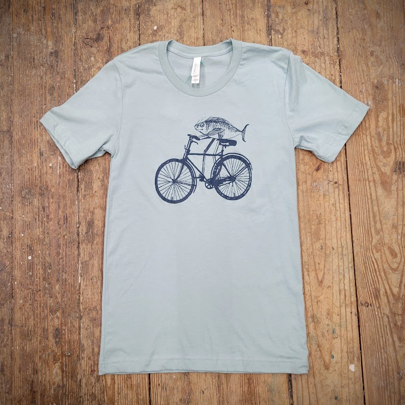 A minty-blue t-shirt with the 'Fish on a Bike' design on the front in navy ink.