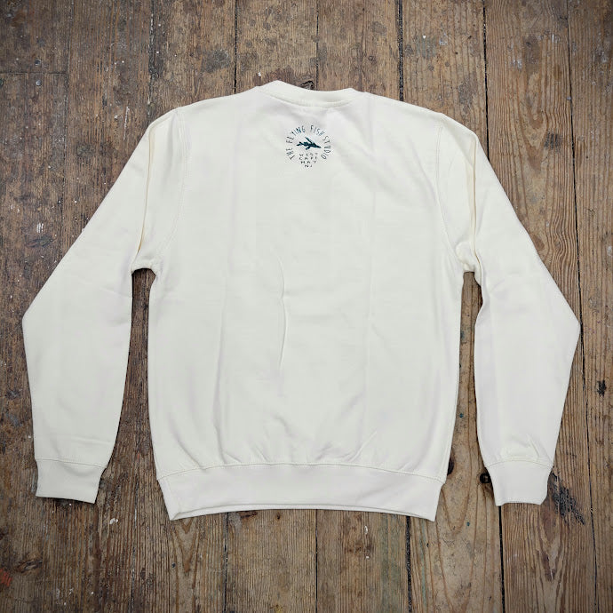 A cream sweatshirt with the 'Flying Fish Studio' design on the back neck in teal ink.