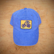 Blue classic, dad hat featuring a 'Fish on a Bike' patch on the front.