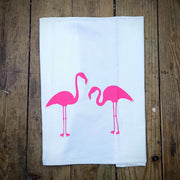White. flour sack tea towel featuring the 'Lynn's Flamingos' design in hot pink ink.