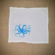 Flour sack napkin featuring the blue 'Octopus' design on the bottom left.
