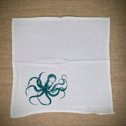 Flour sack napkin featuring the green 'Octopus' design on the bottom left.