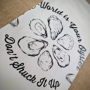 Close-up of the "World is Your Oyster, Don't Shuck it Up' design in black ink.