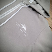 Close-up of the 'Flying Fish Coordinates' design on the left chest.