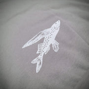 Close-up of the 'Flying Fish' design on the bottom back in white ink.