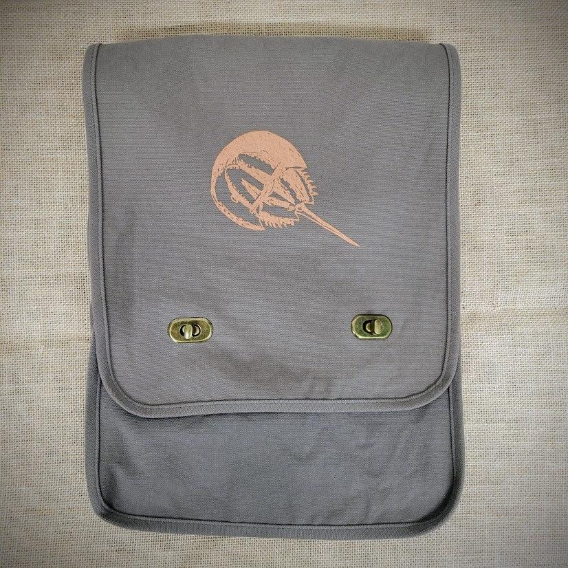 Grey, canvas bag with a brown horseshoe crab on the front.
