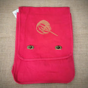 Redish-pink, canvas bag with a brown horseshoe crab on the front.