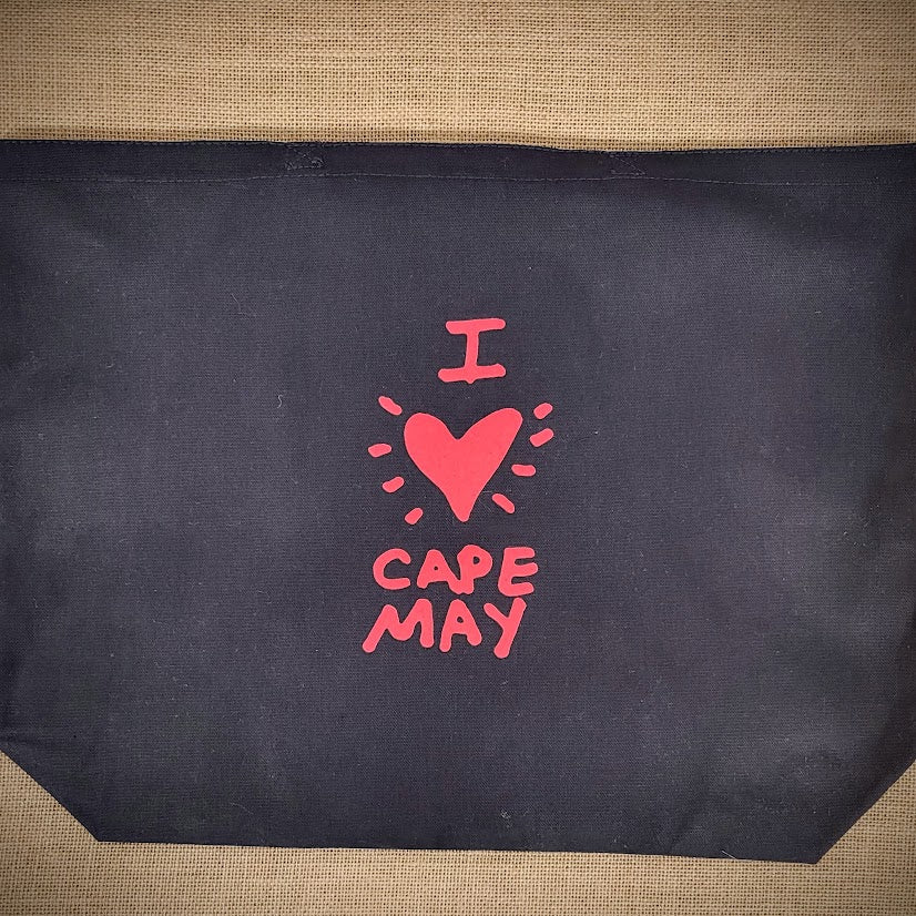 Black, canvas tote bag that reads, ' I (heart) Cape May' in red ink.