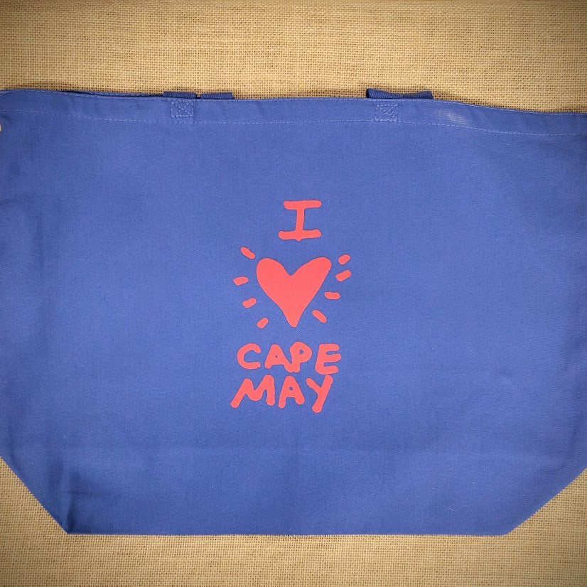 Blue, canvas tote bag that reads, "I (heart) Cape May"in red ink.