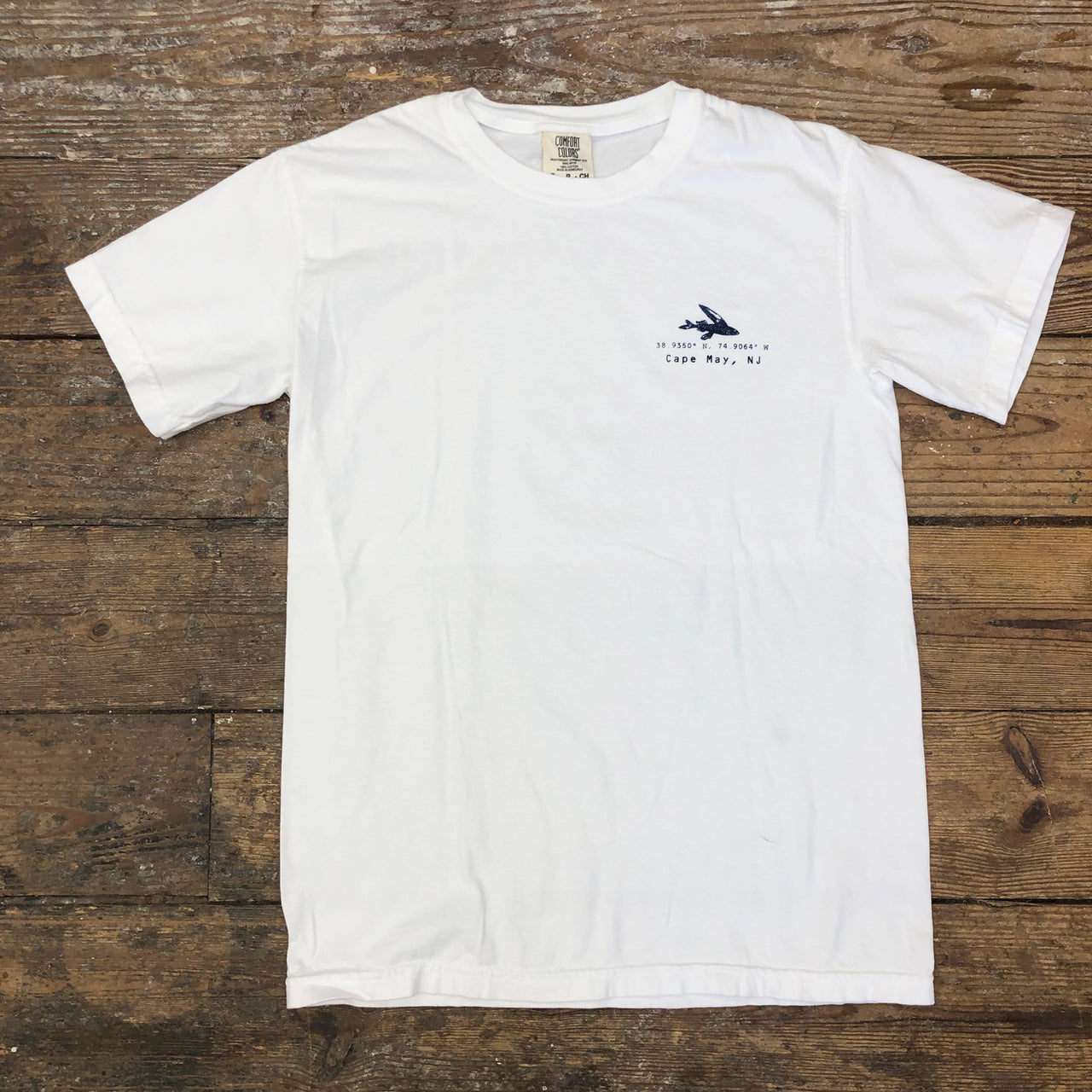 A white t-shirt with the 'Flying Fish: Coordinates' design on the left chest.