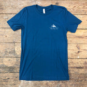 A blue t-shirt with the 'Flying Fish: Coordinates' design on the left chest in white ink.