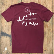 A maroon t-shirt featuring the 'Cape May Point, NJ' design on the back in white ink.