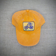 Orange hat with a 'Fish on a Bike' patch on the front.