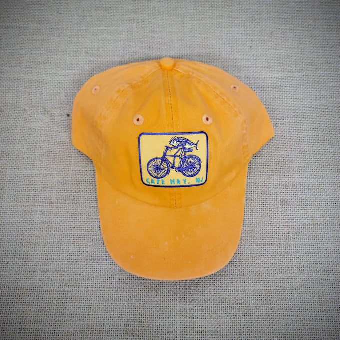 Orange hat with a 'Fish on a Bike' patch on the front.