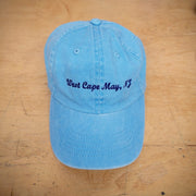 A blue hat with 'West Cape May' embroidered on the front.