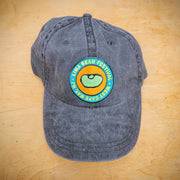 A black, classic hat with a lima bean patch on the front.
