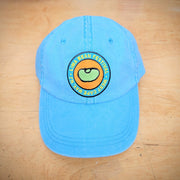 A blue, classic hat with a lima bean patch on the front.