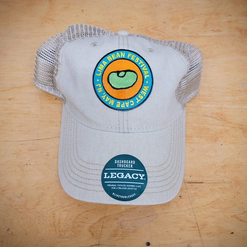 A khaki trucker hat with a lima bean patch on the front.