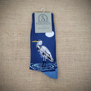 A pair of blue socks with an egret on them.
